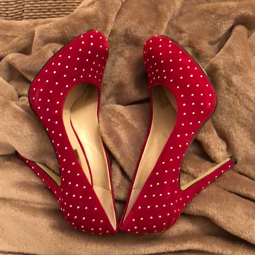 A pair of red gold beaded shoes.